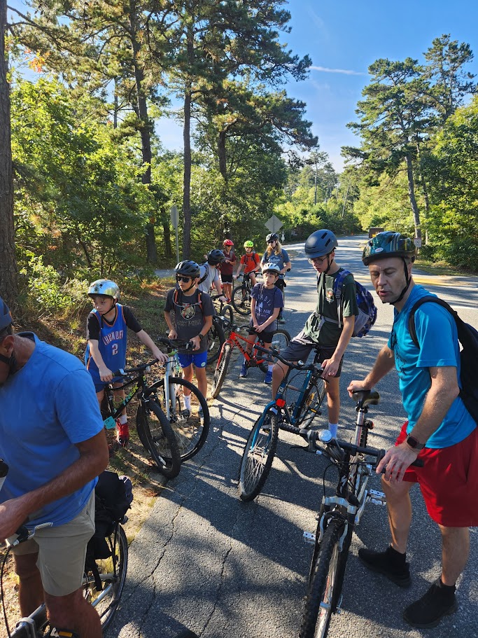 Scouts riding bicycles at Nickerson State Park.